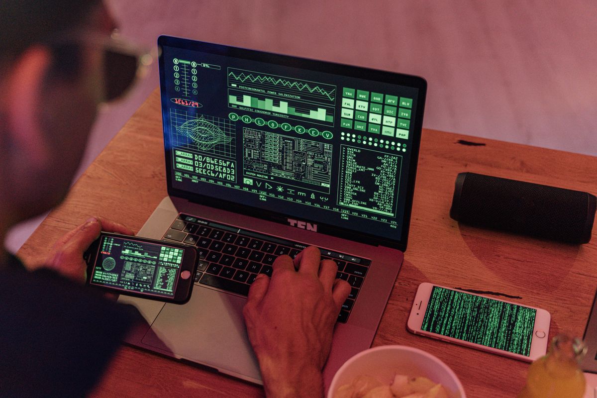 Hands using a tablet at a technology workstation