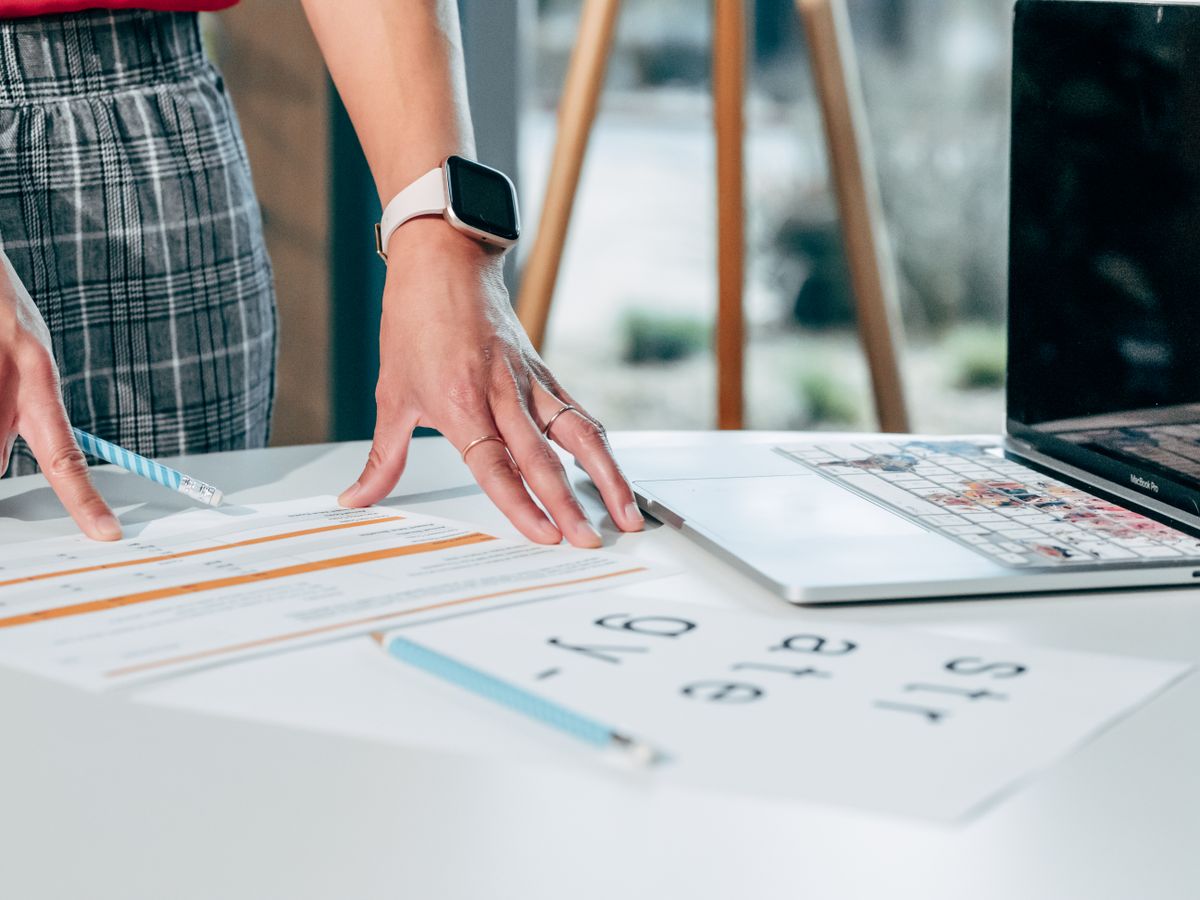 Professional organizing documents at a desk