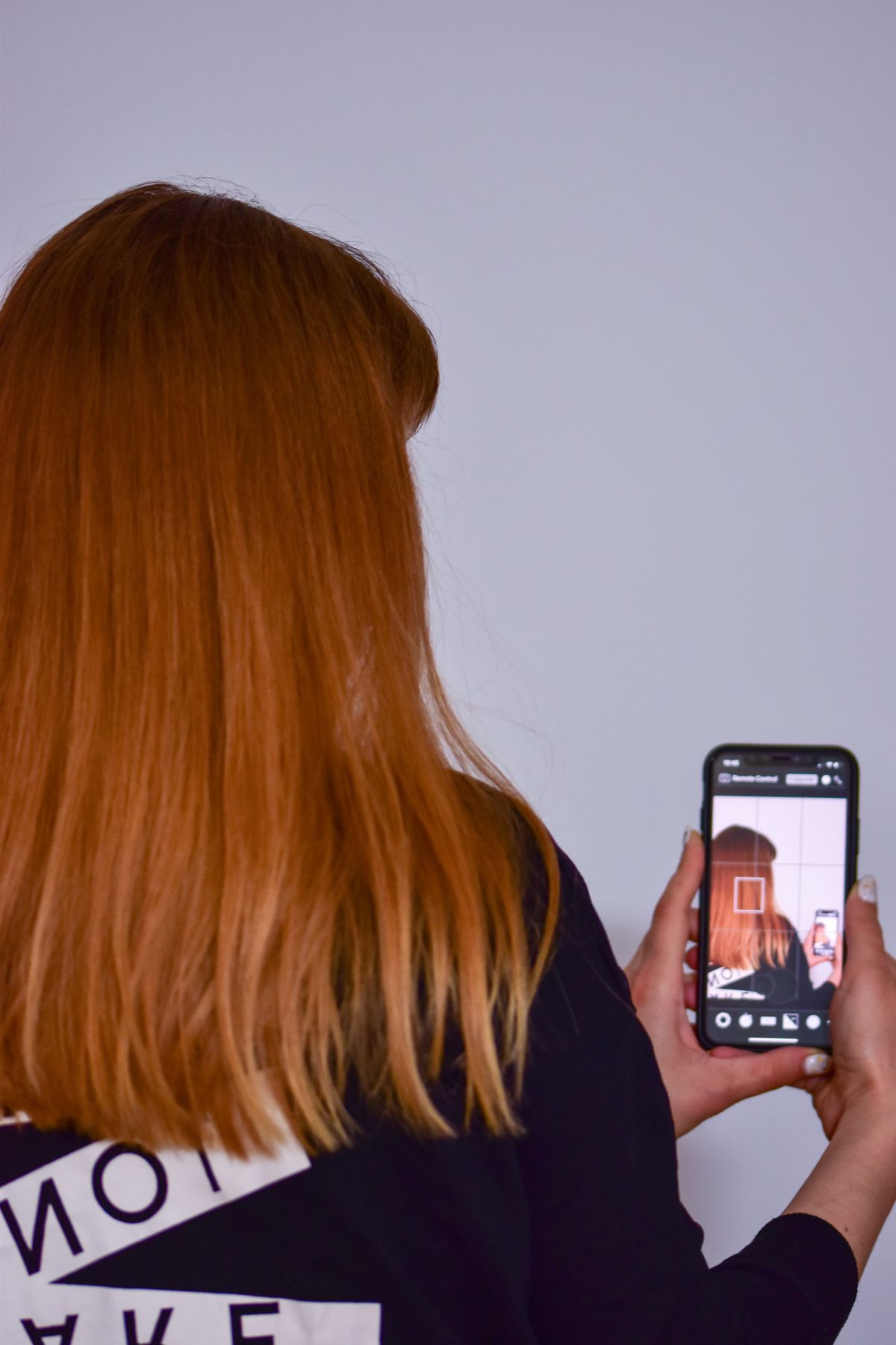Smartphone camera viewed over the shoulder